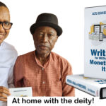 an image of Azu and Sam Amuka with Azu's new book 'Writing for Media and Monetising It'